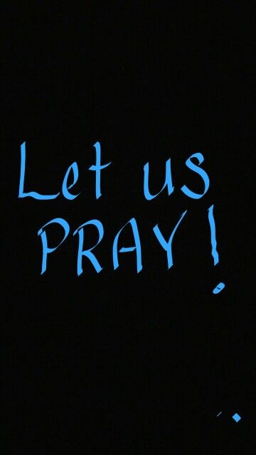 the words let us pray written in blue chalk