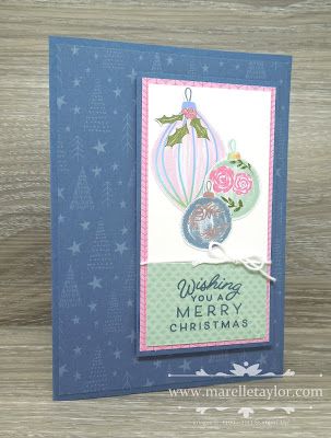 a christmas card with a hot air balloon on the front, and a blue background