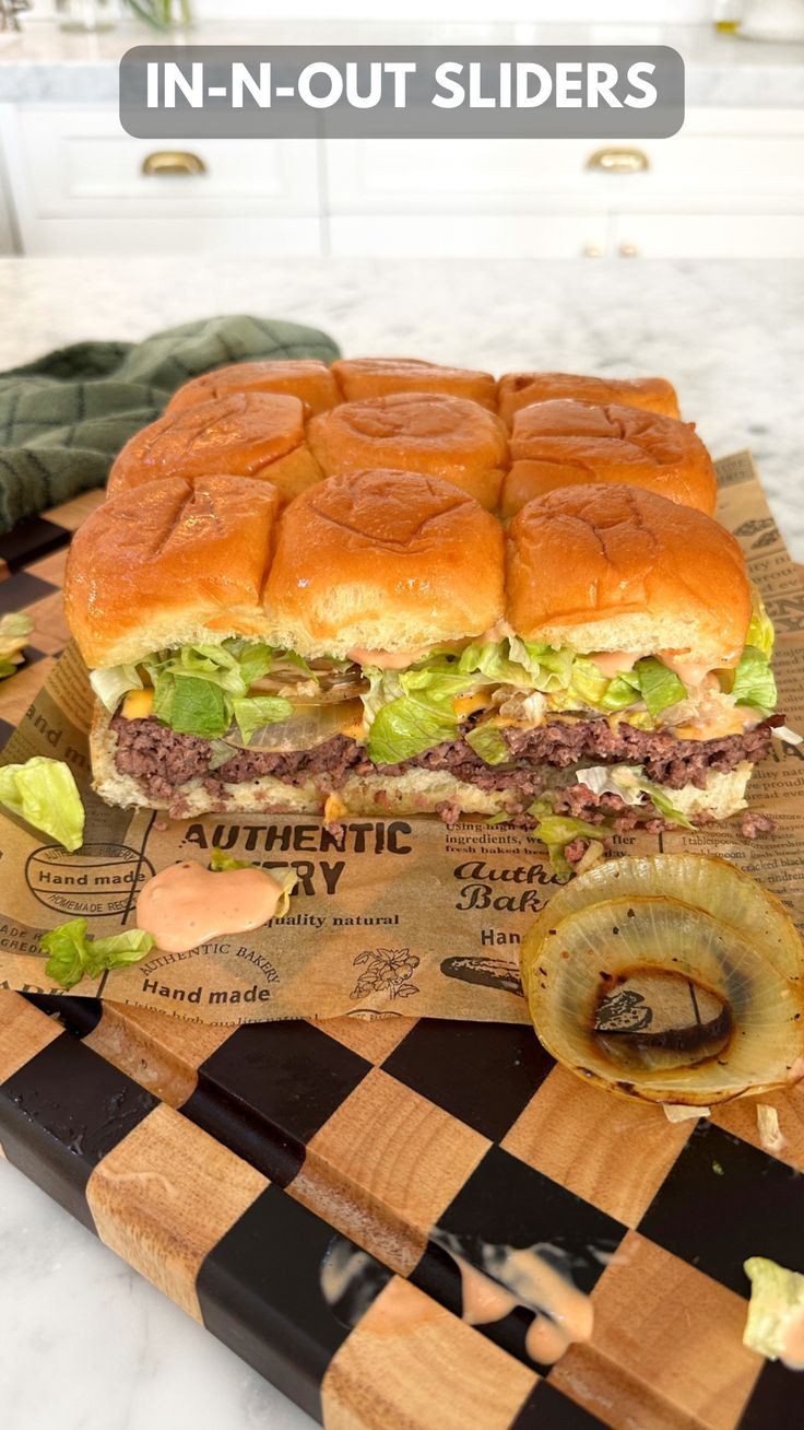 a large sandwich sitting on top of a cutting board