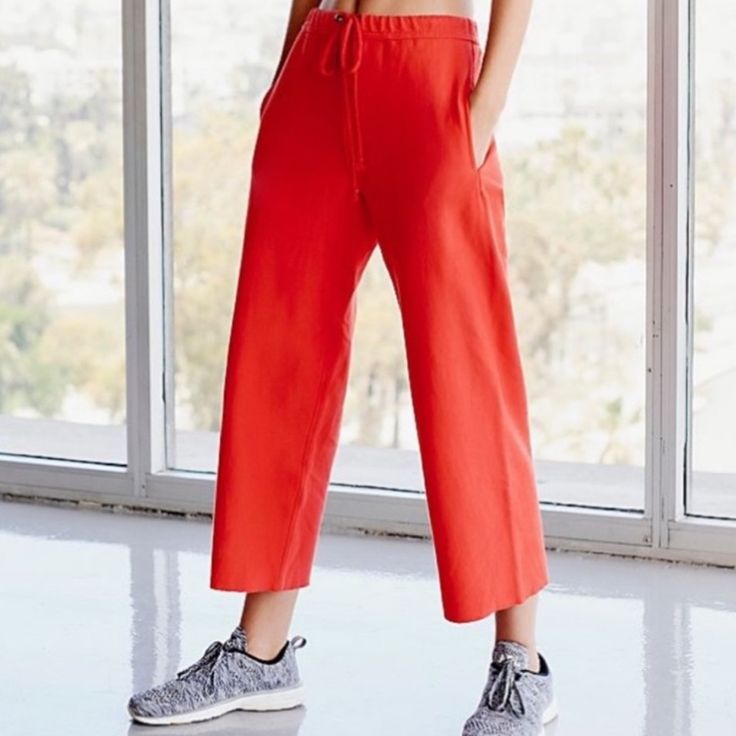 Free People Cropped Wide Leg Pant. Spring Athleisure Orange Bottoms, Red Relaxed Fit Pants For Spring, Sporty Red Summer Pants, Red Ankle-length Loungewear Bottoms, Red Ankle-length Pants For Loungewear, Red Sweatpants With Pockets For Spring, Red Sporty Sweatpants For Spring, Sporty Red Sweatpants For Spring, Sporty Red Pants For Spring