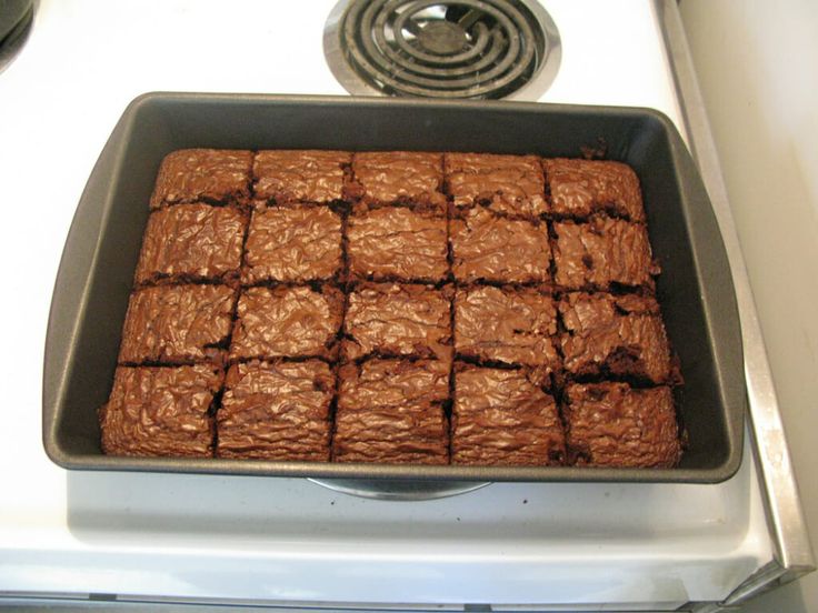 a pan filled with brownies sitting on top of a stove