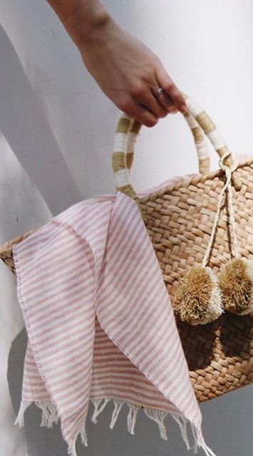 Our St Tropez tote is made of natural seagrass and features matching raffia poms poms. Roomy enough for your beach towel, sunglasses and more. Measurements: 17.5" W x 9.5" H x 5.5" D FINAL SALE Chic Pink Beach Bag For Summer, Trendy Summer Beach Bag For Poolside, Casual Pink Beach Bag For Poolside, Chic Spring Beach Bag, White Summer Beach Bag With Tassels, White Beach Bag With Tassels For Summer, Beige Tasseled Beach Bag For Summer, Beige Tassel Beach Bag For Summer, Beach Bag With Tassels For Beach Season