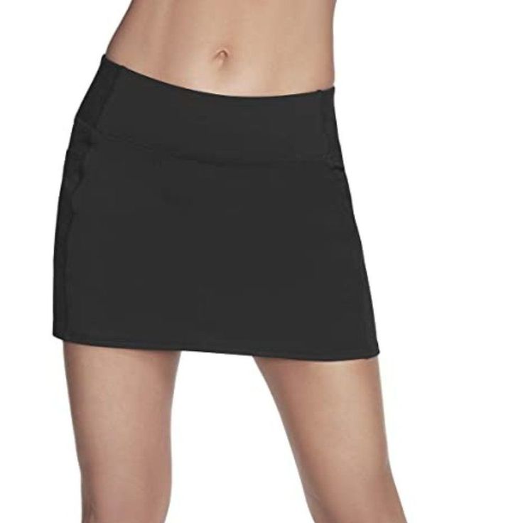 88% Nylon, 12% Spandex Imported Pull On Closure Machine Wash Goflex Features A Soft “Cotton-Like” Hand Feel And Matte Finish 88% Nylon, 12% Spandex Mesh Lining: 92% Polyester, 8% Spandex High-Waisted Exterior Side Pockets Sports Skirt In Elastane, Fitted Black Sports Skirt, Solid Elastane Sports Skirt, Solid Elastane Skirt For Sports, Fitted Black Skirt For Sports, Black 4-way Stretch Skort For Spring, Fitted Black Tennis Skirt With Pockets, Black Fitted Tennis Skirt With Pockets, Stretch Black Mini Skirt For Sports