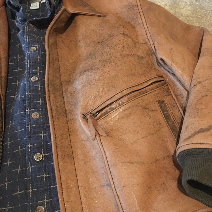 Full Grain Leather With Beautiful Inner Lining. Outside You Have 2 Zippered Along With 2 Additional Hand Warmer Pockets. Inside Are Also One Buttoned As Well As Another Zipper Pocket. All In Perfect Condition. Blue Shirt Not Included. Vintage Brown Rugged Outerwear With Pockets, Rugged Brown Outerwear With Flap Pockets, Fitted Rugged Distressed Brown Outerwear, Distressed Brown Fitted Rugged Outerwear, Distressed Brown Fall Outerwear With Pockets, Distressed Brown Outerwear With Pockets For Fall, Distressed Brown Long Sleeve Outerwear With Pockets, Rugged Distressed Brown Outerwear For Fall, Rugged Distressed Brown Outerwear For Outdoor