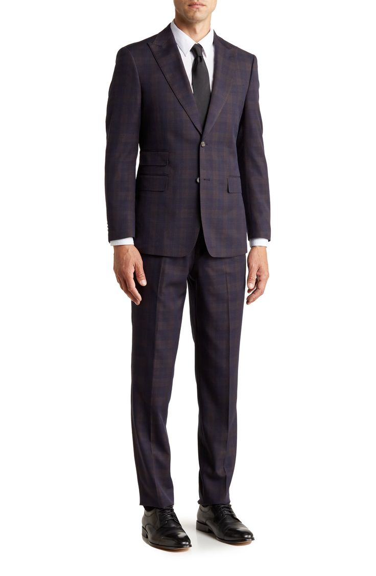 Make a dapper appearance at your next formal event in this clean-cut plaid suit that includes a peak lapel jacket and flat-front trousers. Jacket: 30.5" length (size 40R); trousers: 11" rise, 36" inseam (size 33W) Jacket has four-button cuffs; chest welt pocket; front flap pockets Trousers have zip fly closure; front pockets; back pockets Shell: 79% polyester, 20% rayon, 1% spandex Lining: 100% polyester Dry clean Imported Model stats: 6'1" height, 32" waist. Model is wearing size (size 33W). Elegant Plaid Suit With Notch Lapel, Plaid Single Breasted Suits For Business Casual, Dapper Business Suit With Notch Lapel, Dapper Formal Suits With Welt Pockets, Plaid Suits With Welt Pockets For Business, Dapper Suits With Welt Pockets For Formal Occasions, Semi-formal Plaid Suit With Notch Lapel, Plaid Suits With Welt Pockets And Suit Collar, Plaid Business Suit With Suit Collar