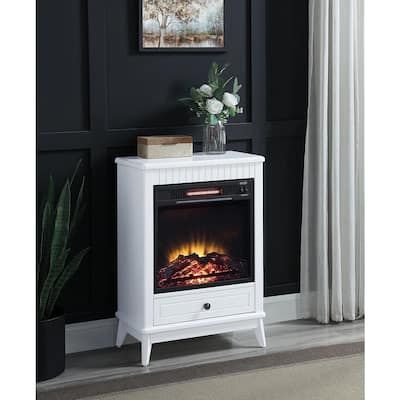 a white night stand with an electric fireplace in the center and flowers on top, against a black wall