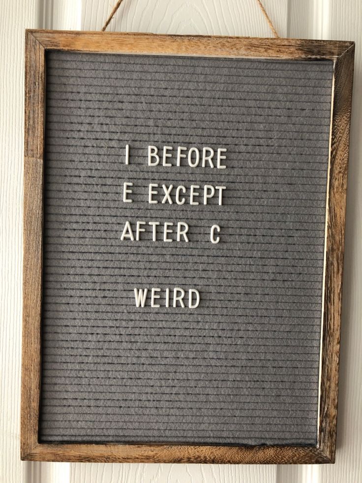 a sign hanging on the side of a door that says i before except after c weird