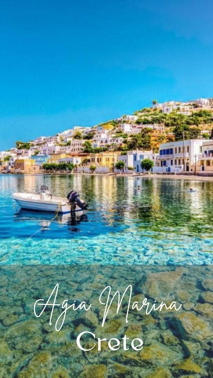 a boat floating on top of a body of water next to a shore covered in rocks