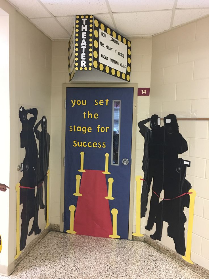 an entrance to a classroom decorated with black and yellow paper cutouts that say you set the stage for success