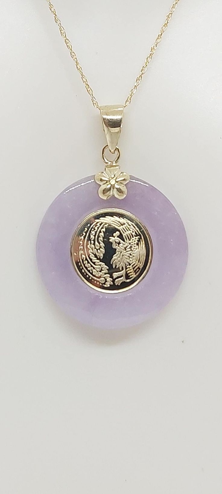 DRAGON Lavender Jade 14K Yellow Gold 18" ROPE Chain pendant. 20x 20mm Lavender Jade 14K YG Dragon character in the center for LAVENDER Jade lover. -Product Info: - Stone: Lavender Jade.  - Stone Measures: 20mm x 20mm Lavender Jade. - Pendant Measures: 30x20mm - Metal: 14k Solid Gold. - Chain Length: 18 Inches Rope Chain. - Nice Gift Box Included Jade Dragon Necklace, Jade Necklaces, Dragon Character, Lavender Jade, Jade Dragon, Purple Jade, Dragon Necklace, Jewelry Accessories Ideas, Jade Necklace