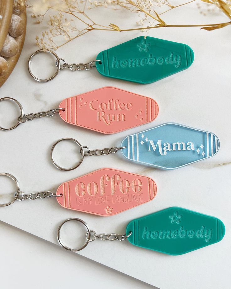 four keychains with the words coffee run and mama on them