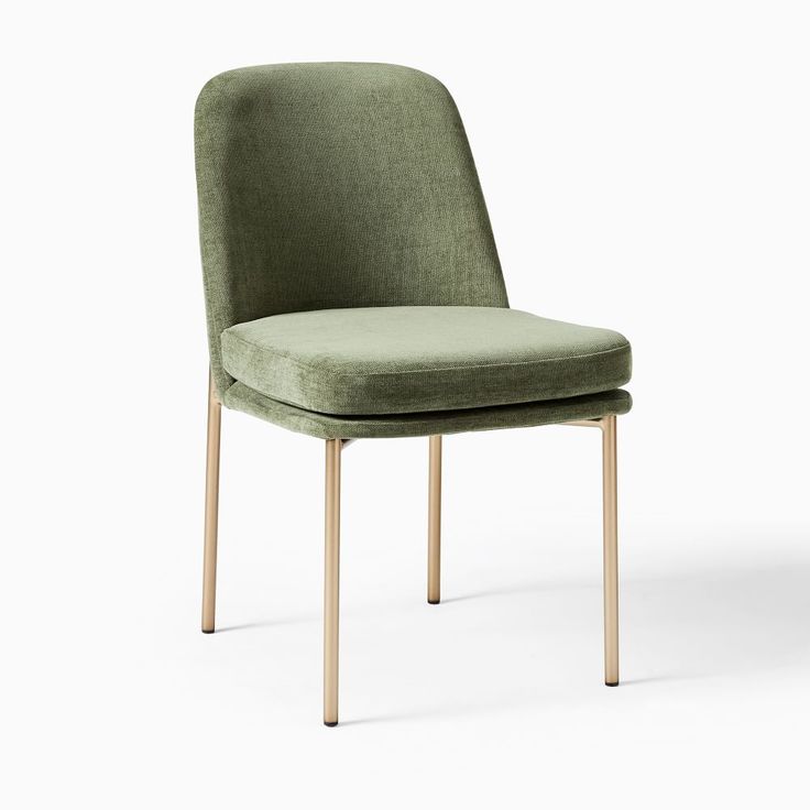 an upholstered green chair with wooden legs and back rests against a white background