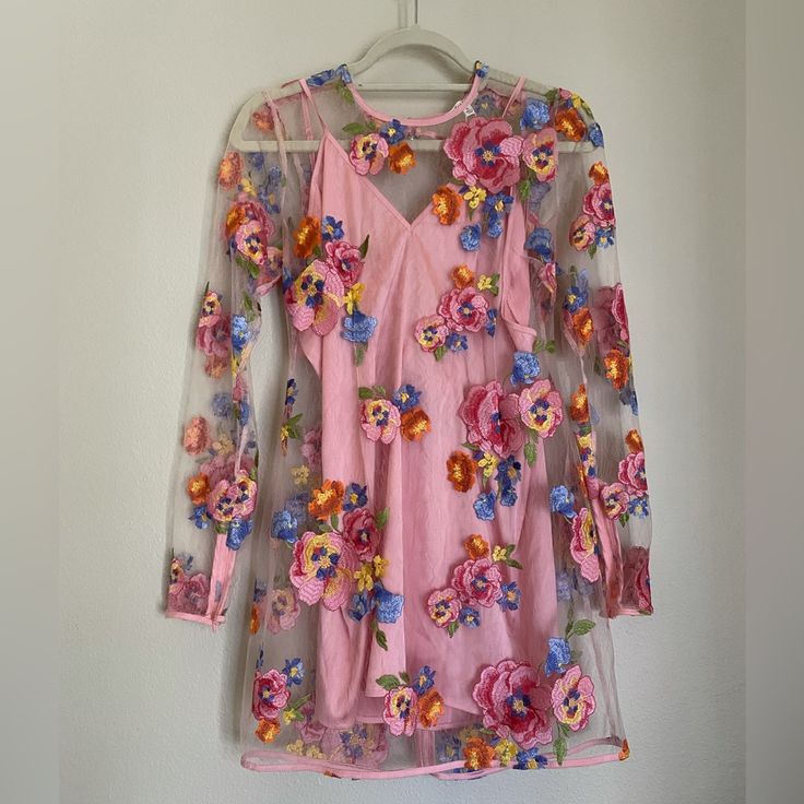 Beautiful Floral Dress. Tie Back With A Zipper On The Bottom. Sleeves Also Have Zipper On Bottom, See Picture. Never Worn. Spring Garden Party Dress With Sheer Sleeves, Feminine Summer Dress With Sheer Sleeves, Spring Mini Dress With Sheer Sleeves, Feminine Sheer Dress For Spring, Sheer Feminine Dress For Spring, Pink Sheer Dress For Garden Party, Summer Brunch Dresses With Sheer Sleeves, Sheer Mini Dress For Spring, Spring Party Mini Dress With Floral Applique