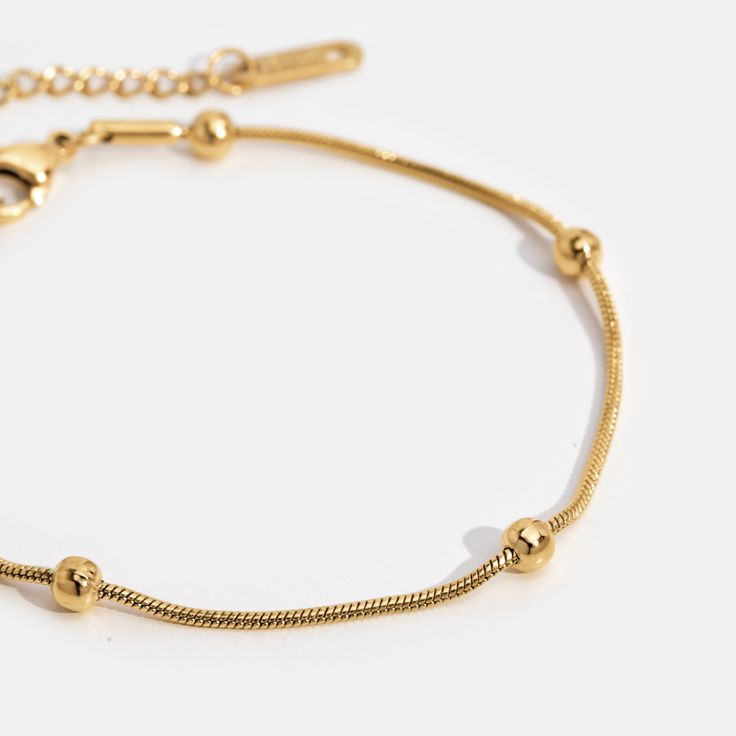 Simple, elegant, and perfect for day or night. This stunning bracelet is guaranteed to be an everyday essential for years to come. Waterproof & tarnish-free Titanium steel, gold plated Length: 6.3in (+ 2in adjustable) Lobster clasp closure Hypoallergenic, lead & nickel free If you aren't in LOVE with your purchase, please let us know within 30 days of receiving your item, and you'll receive a stress-free refund. Adjustable Minimalist Stainless Steel Bracelets, Trendy Adjustable Gold Bracelet With Delicate Chain, Adjustable Stainless Steel Chain Bracelet For Everyday, Everyday Adjustable Stainless Steel Chain Bracelet, Adjustable Gold Charm Bracelet For Everyday, Adjustable Metal Chain Bracelet, Tarnish Resistant, Everyday Metal Bracelets With Adjustable Length, Dainty Stainless Steel Bracelet With Adjustable Chain, Everyday Adjustable Metal Bracelets