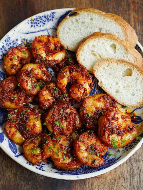 a plate with bread and some shrimp on it