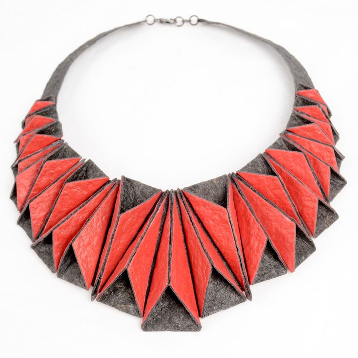 Mixed-Media Necklace - This beautiful, dimensional necklace lays like a collar, standing out for both its structure and shine. Inspired by origami, each piece manipulated by hand and attached to the necklace, not each other, so the necklace can be molded to the wearers neck. Made from hand painted faux leather made from recycled coconut husks, eco friendly, waterproof and an absolute conversation piece! Mixed Media Necklace, Pebble Jewelry, Laser Cut Leather, Chunky Necklaces, Geometric Inspiration, Acrylic Necklaces, Laser Cut Jewelry, Art Jewelry Contemporary, Necklace Ideas