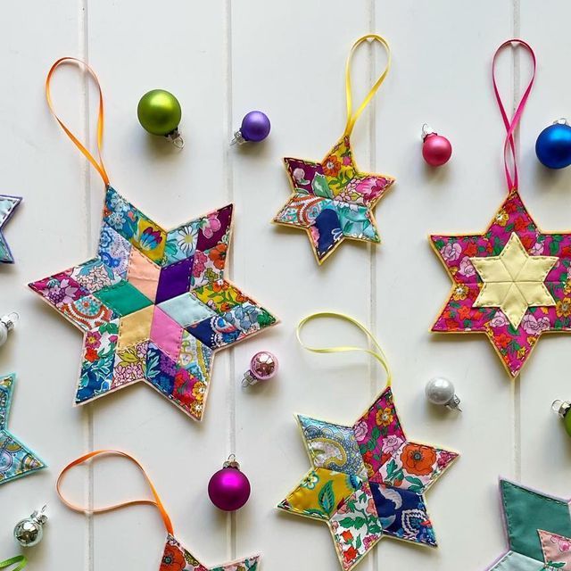 colorful ornaments are arranged on a white surface