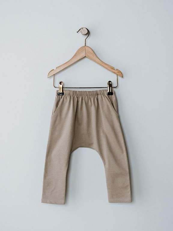 Comfort and style come together perfectly in this playtime favorite. Featuring a dropped crotch, harem silhouette, and hidden drawstring in the waistband, this trouser is made with our luxuriously soft organic cotton. Pair it with any of our cozy basics like The Boxy Tee or our Short Sleeve Pocket Onesie. Reshape whils Essential Sweater, Harem Trousers, Gray Label, Toddler Tops, Boxy Tee, Knitted Romper, Organic Fabrics, Swimwear Sale, Come Together