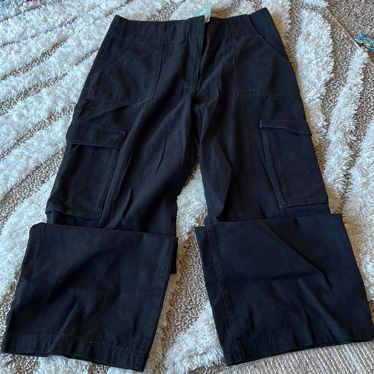 Women Cargo Wide Legs Brand: H&M Size: 14 Color: Black New With Tags Mid-rise Black Cargo Pants For Workwear, H&m High Rise Workwear Bottoms, H&m High Waist Bottoms With Pockets, H&m Trousers With Pockets, H&m High-waist Bottoms With Pockets, Black Trousers From H&m, H&m Wide Leg Pants With Pockets, H&m Black Wide Leg Bottoms, H&m Black Trousers