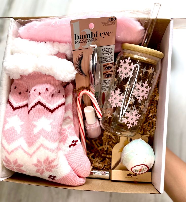 a box filled with lots of items including socks and snowflakes on top of it