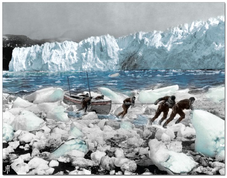 three men are standing on ice chunks near a boat in the water and one man is reaching for something