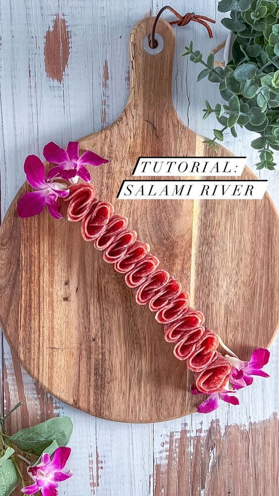 a cutting board with flowers on it and a sign that reads,'floral savannah river '