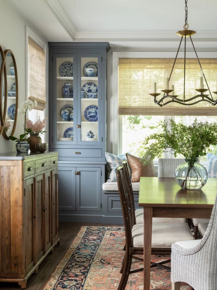 a dinning room table with chairs and plates on it