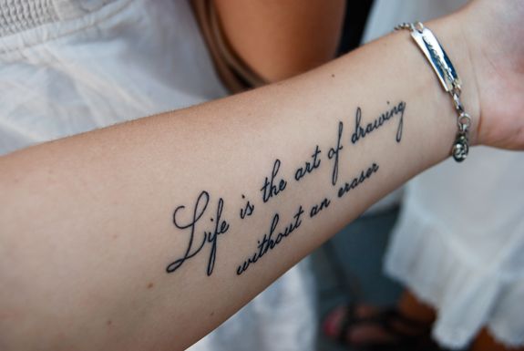 a woman with a tattoo on her arm that says, you can't stop believing