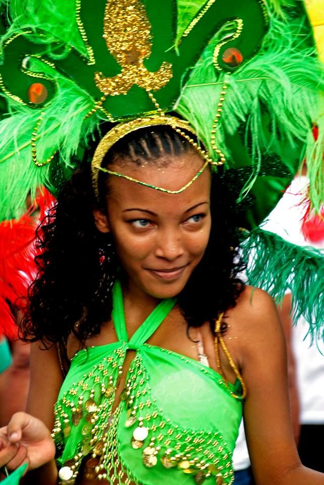 a woman in a green costume and headdress