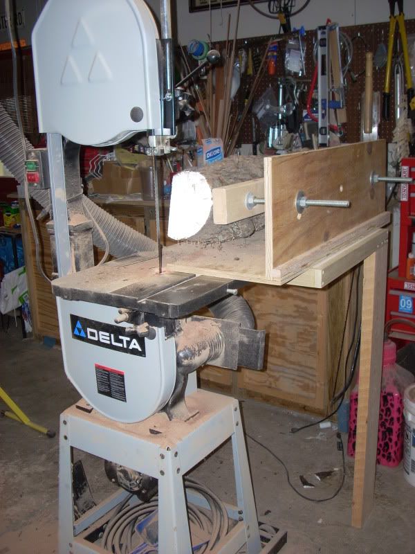 a table sawing in a workshop with lots of tools