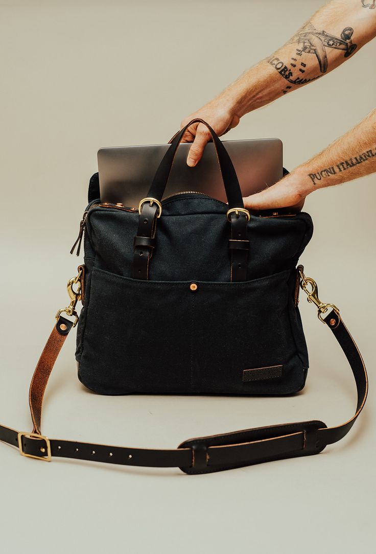 A work friendly messenger bag. Intended to organize laptop, pens, phones, and books. Constructed of American-made leather, waxed canvas, and brass. Work Bag, Waxed Canvas, American Made, Snap Button, Leather Trims, Messenger Bag, Handles, Laptop, Brass