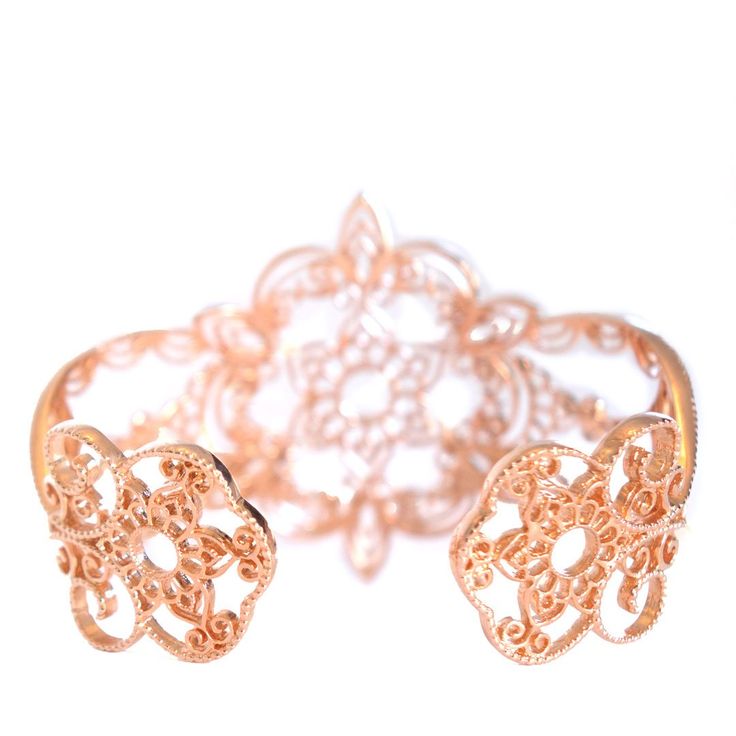 Like a starbust shining brightly, our Star cuff bracelet radiates style through a blend of floral motifs, and scrolling henna-inspired filigree. Its scalloped edges are highlighted by beads of granulation: a traditional craft technique often associated with jewelry of ancient cultures. You'll also discover subtle odes to the Filienna brand with flourished "f" motifs subtly nestled into the Star Cuff's design. Filienna jewelry is made from our proprietary Filienna blush silver alloy – a blend of Elegant Festive Cuff Bracelet Bangle, Luxury Adjustable Cuff Bracelet With Intricate Design, Adjustable Luxury Bracelets With Intricate Design, Luxury Adjustable Bracelets With Intricate Design, Luxury Bracelets With Intricate Design For Festive Occasion, Luxury Bracelet With Intricate Design For Festive Occasions, Luxury Intricate Design Bracelet For Festive Occasion, Elegant Rose Gold Cuff Jewelry, Elegant Filigree Bangle As Gift