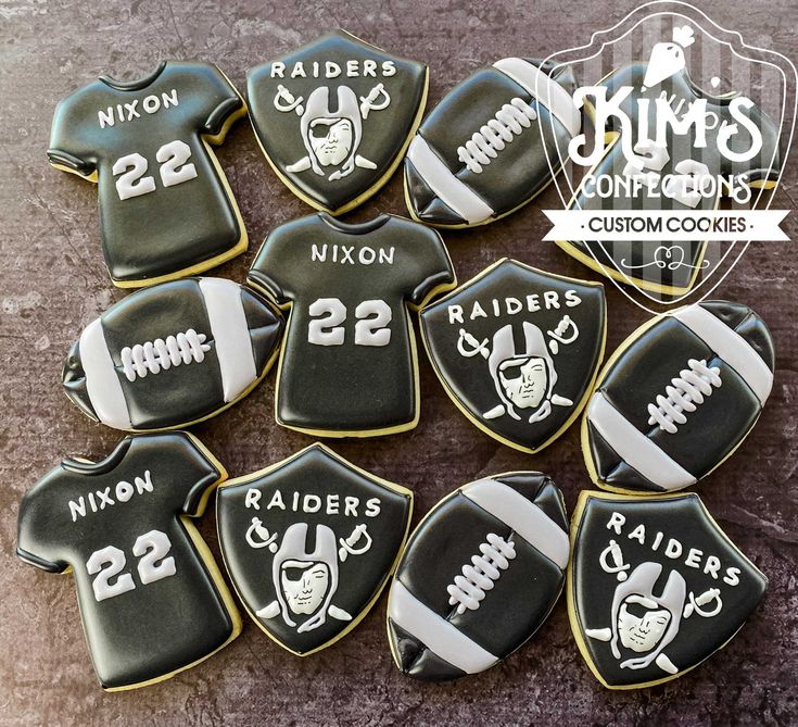 decorated cookies are arranged in the shape of football jerseys and numbers for sports teams