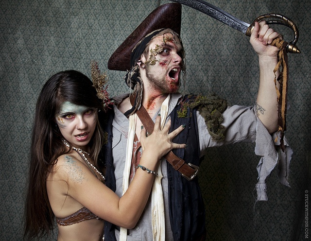 a man and woman dressed up as pirates