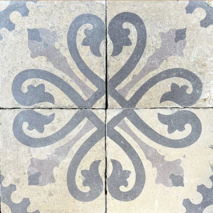 an artistic tile design in grey and white