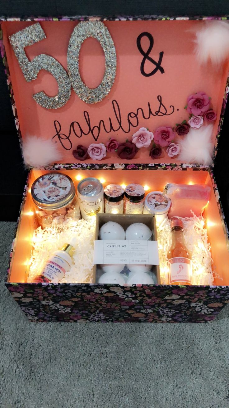 an open box with candles and other items inside