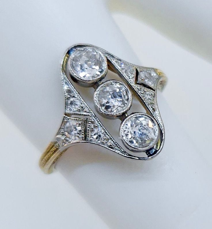 Thank you for viewing this beautiful antique Edwardian 1910's 14k & platinum  diamond ring.  The ring contains 9 diamonds weighting between .60 and .70 carats.  The diamonds are an average quality of H color SI clarity.  The ring size is 4.25.  The weight of the ring is 2.1 grams.  The ring comes with an attractive gift box. Platinum Diamond Ring, Antique Jewelry Rings, Platinum Diamond Rings, Ring Pictures, Modern Jewelry, Vintage Watches, Rings Statement, Antique Jewelry, Favorite Jewelry