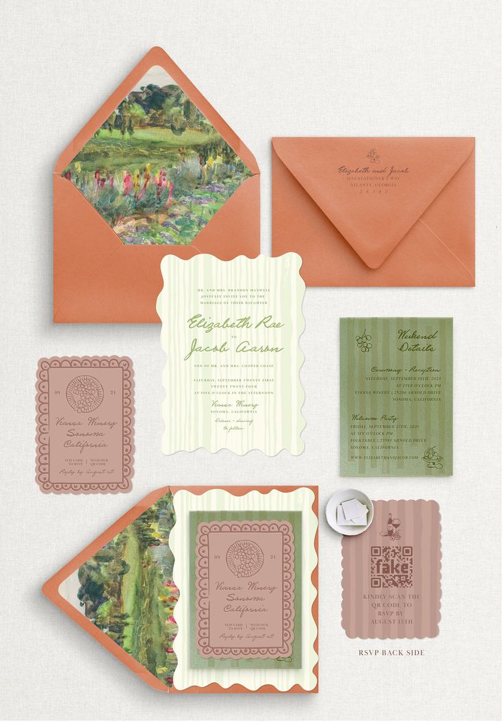 an assortment of wedding stationery and envelopes