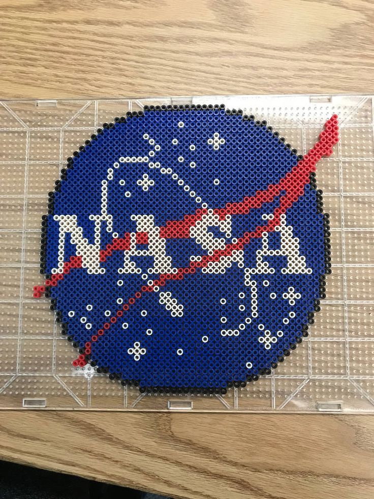 the nasa needled patch is on top of a piece of fabric that has been stitched together