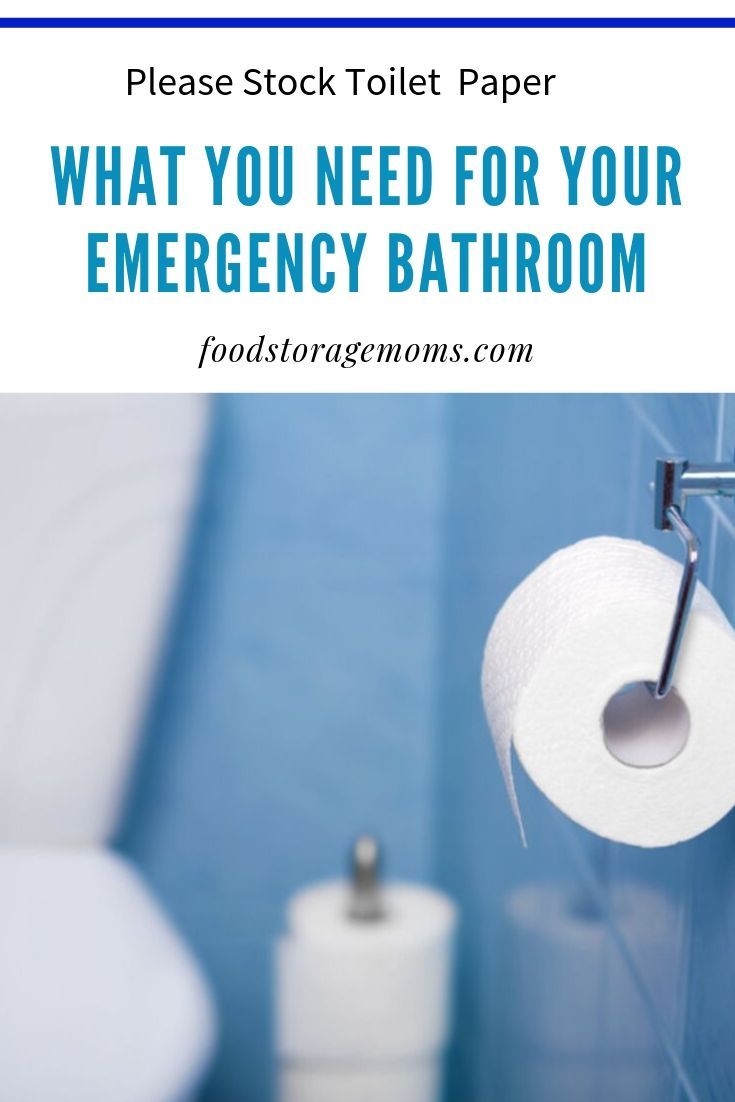 a bathroom with blue walls and white toilet paper