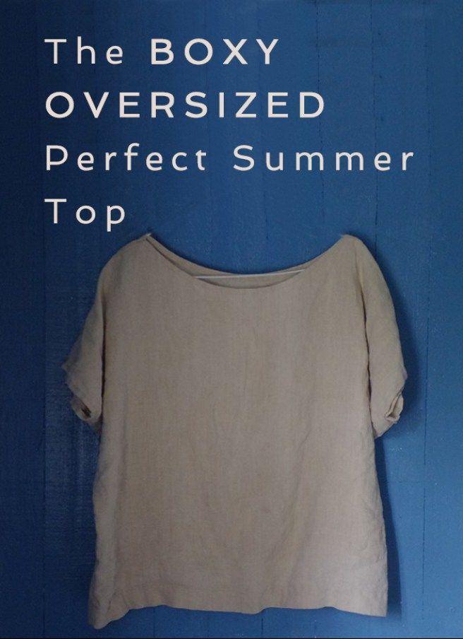 the boxy oversized perfect summer top is hanging on a blue wall with text over it