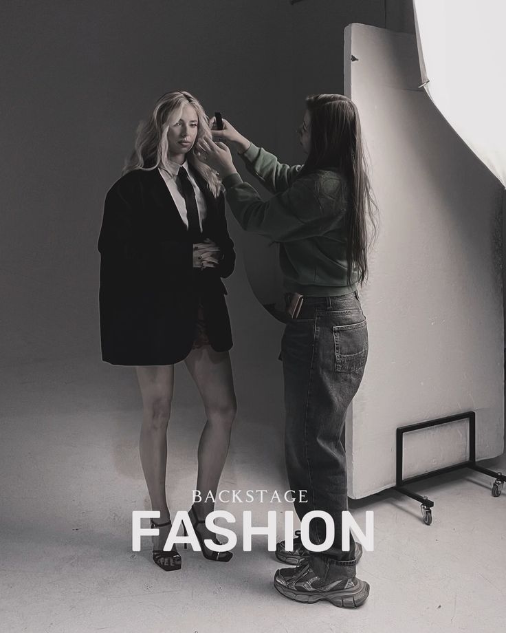 two women standing next to each other in front of a white backdrop with the words backstage fashion on it