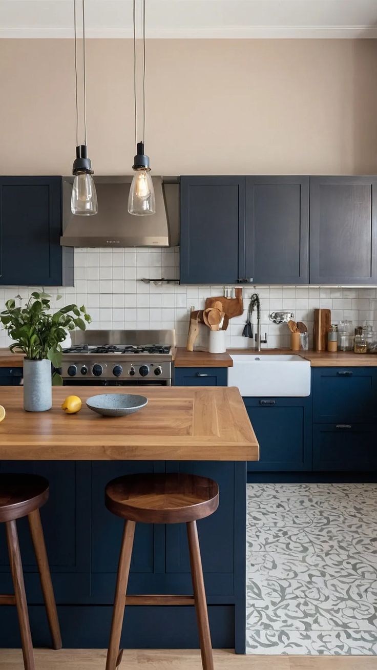 a kitchen with blue cabinets and wooden stools in front of the island countertop