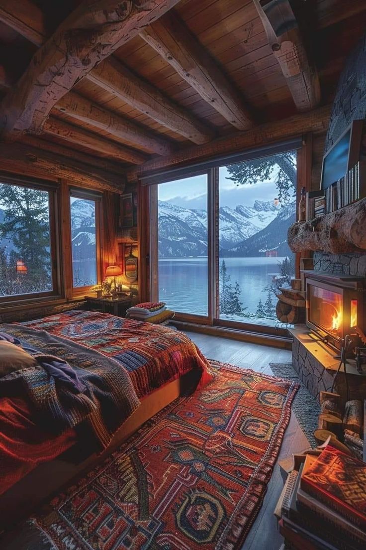 a bedroom with a large bed and a fire place in the corner next to it