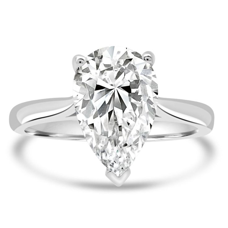 a pear shaped diamond ring on a white background with the center stone in the middle