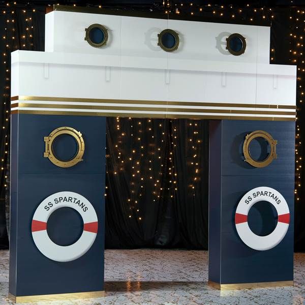 two blue and white pedestals with red and white signs on them in front of a black backdrop