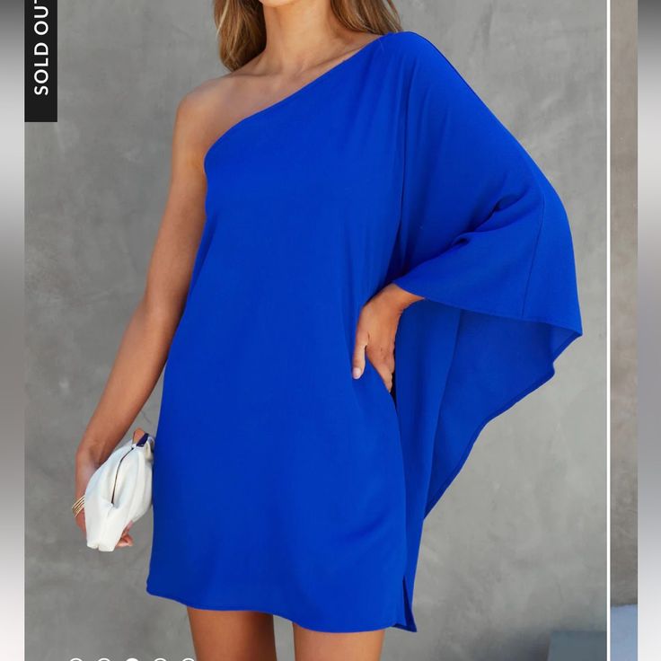 Questions? Leave A Comment Below! Blue Flowy Chic Mini Dress, Flowy One Shoulder Mini Dress For Party, Royal Blue Mini Dress For Summer Cocktail, Solid Color One Shoulder Vacation Dress, One-shoulder Dress For Vacation, One-shoulder Vacation Dress, Solid Color One-shoulder Vacation Dress, Elegant Blue Mini Dress For Beach, Blue One-shoulder Dress For Vacation