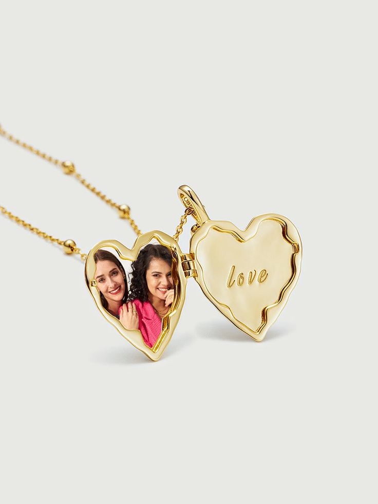 A cherished keepsake that allows you to carry your most precious memories close to your heart. This exquisite pendant features a heart-shaped locket, meticulously crafted with the finest attention to detail and designed to hold a special photo of your choosing. This versatile pendant is suitable for everyday wear or as a special piece for significant occasions. Whether it's a cherished family photo, a picture of a loved one, or a memento of a memorable event, this locket serves as a tangible rem Heart Pendant Locket Necklace For Valentine's Day, Valentine's Day Heart Pendant Locket Necklace, Elegant Personalized Double Heart Locket Necklace, Heart Locket Necklace For Valentine's Day Anniversary, Mother's Day Double Heart Engraved Locket Necklace, Heart Charm Jewelry For Valentine's Day Keepsake, Wedding Heart Pendant Locket Necklace With Charms, Keepsake Locket Necklace For Valentine's Day, Engraved Heart Pendant Locket For Personalized Gift