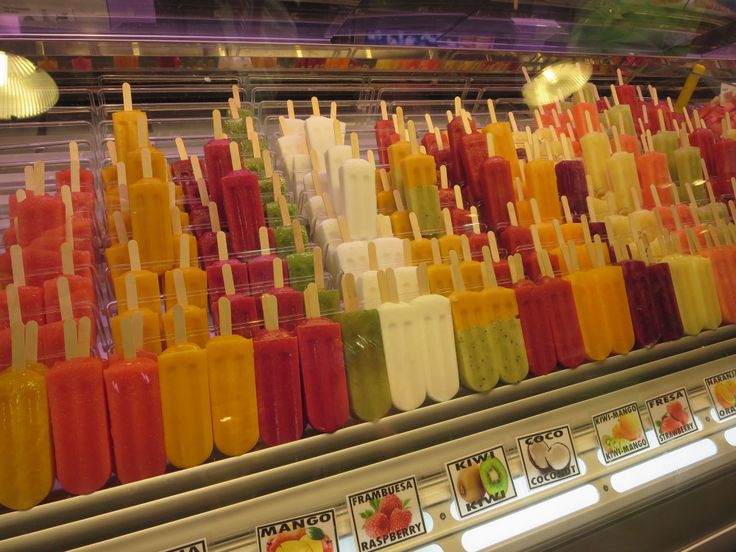 many popsicles are lined up on the shelf