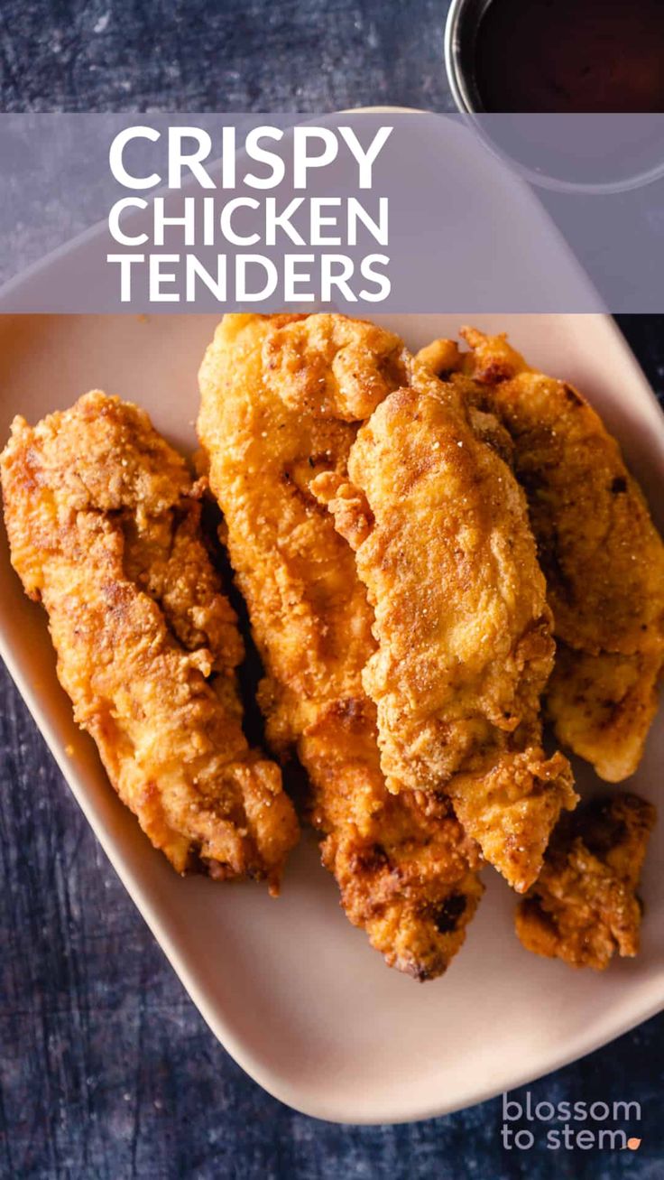 crispy chicken tenders on a plate with dipping sauce